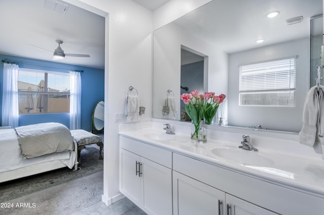 bathroom featuring tile patterned floors, ceiling fan, vanity, and a healthy amount of sunlight