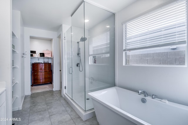 bathroom with tile patterned flooring and plus walk in shower