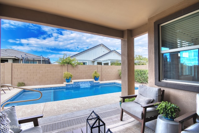 view of swimming pool with a patio