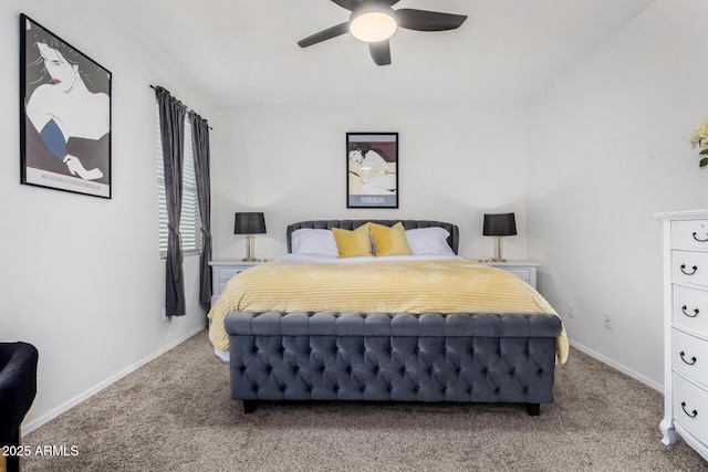 carpeted bedroom featuring baseboards and a ceiling fan