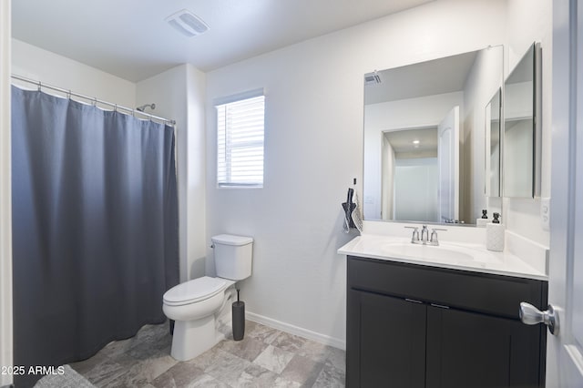 bathroom with toilet and vanity