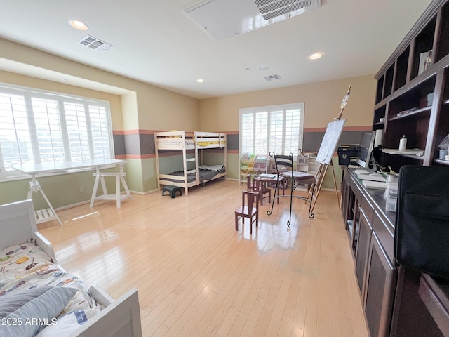 interior space featuring visible vents, light wood-style flooring, and recessed lighting