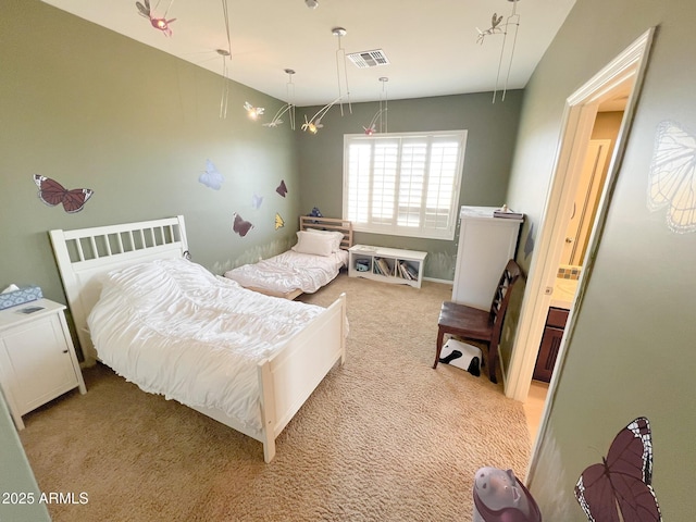 bedroom with light carpet and visible vents