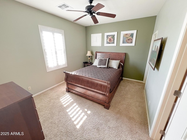 bedroom featuring baseboards, visible vents, and carpet flooring