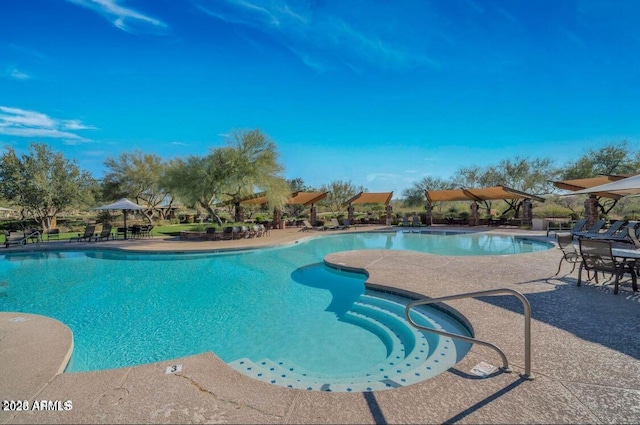 community pool with a patio area