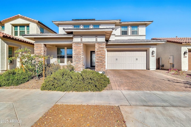 prairie-style home featuring a garage