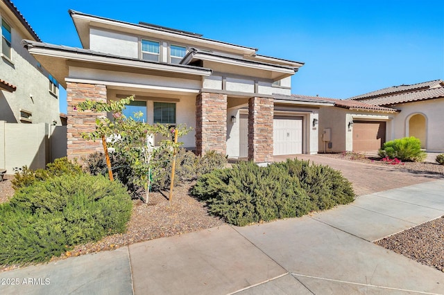 view of front of property with a garage