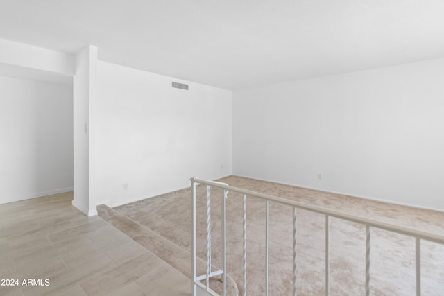 spare room featuring light hardwood / wood-style flooring