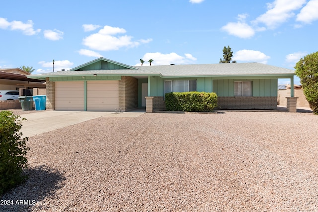 ranch-style house featuring a garage