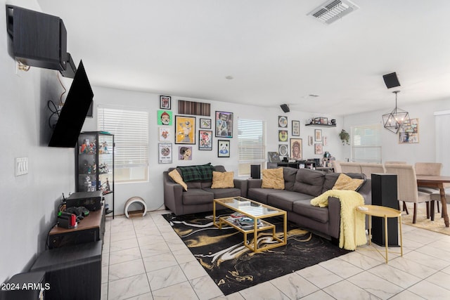 living room with a notable chandelier