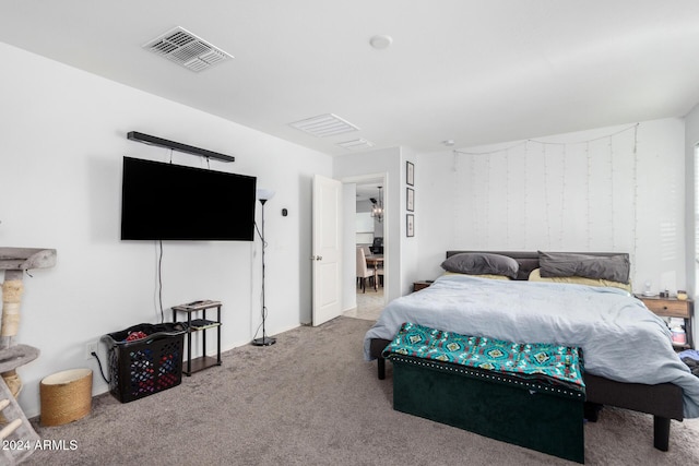 bedroom with light colored carpet