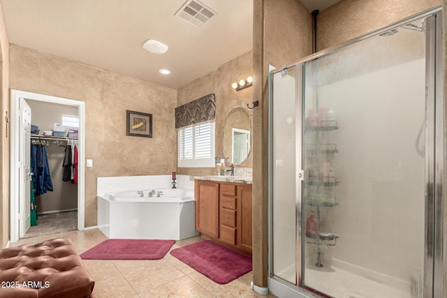 full bath featuring a bath, a stall shower, vanity, and visible vents