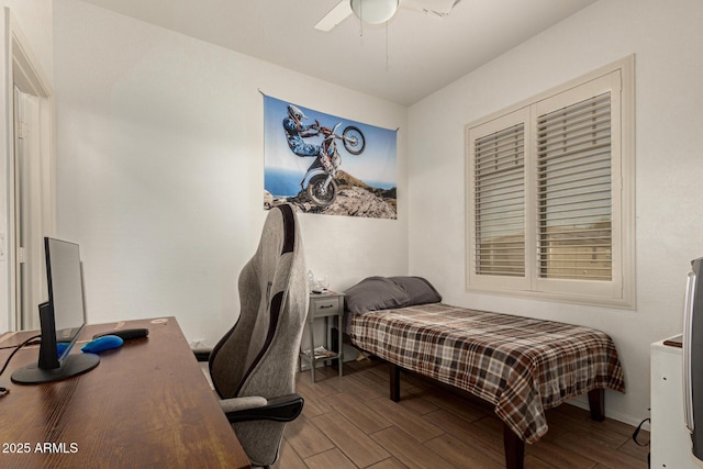 bedroom with ceiling fan and wood finished floors