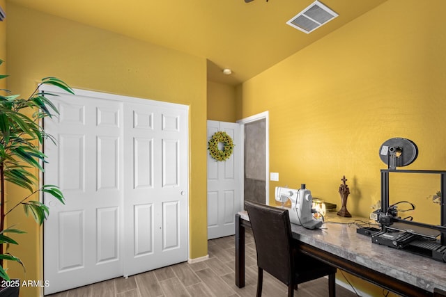 office space with wood finish floors and visible vents