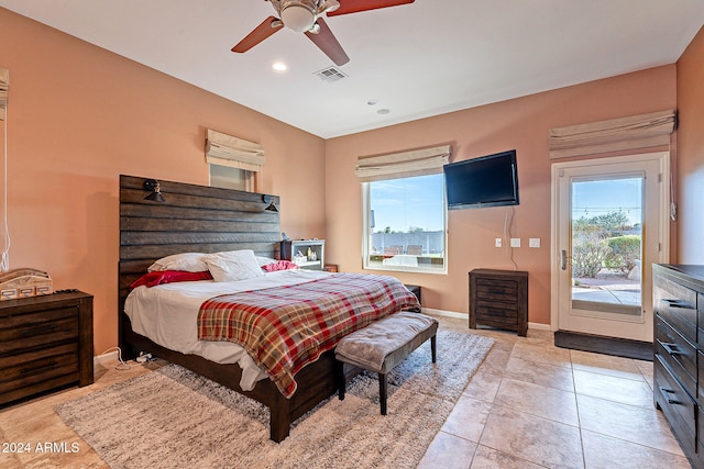 tiled bedroom with access to outside and ceiling fan