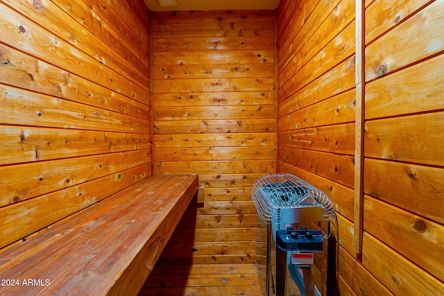 view of sauna with hardwood / wood-style flooring and wood walls