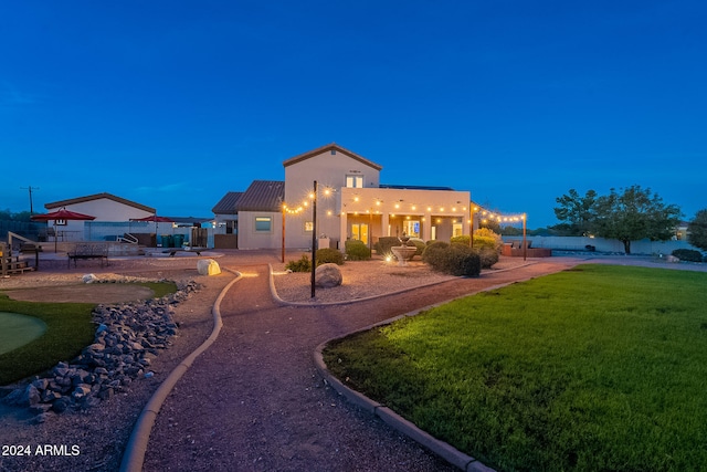 exterior space with a patio and a lawn