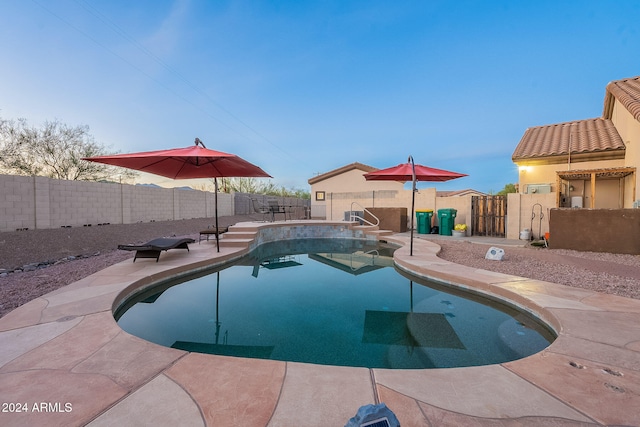 view of swimming pool featuring a patio area