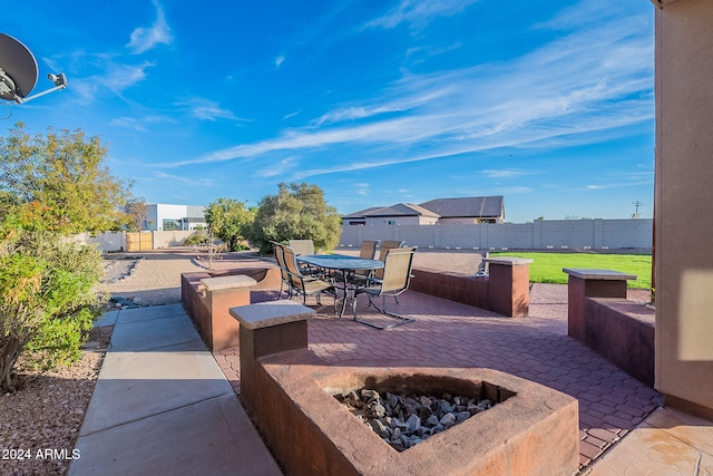 view of patio featuring a fire pit