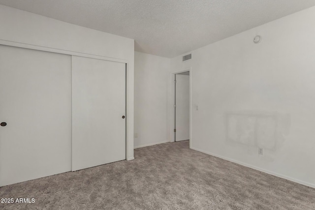 1501 E Colonial Dr, Chandler, AZ 85249 - unfurnished bedroom featuring visible vents, a textured ceiling, a closet, and carpet flooring