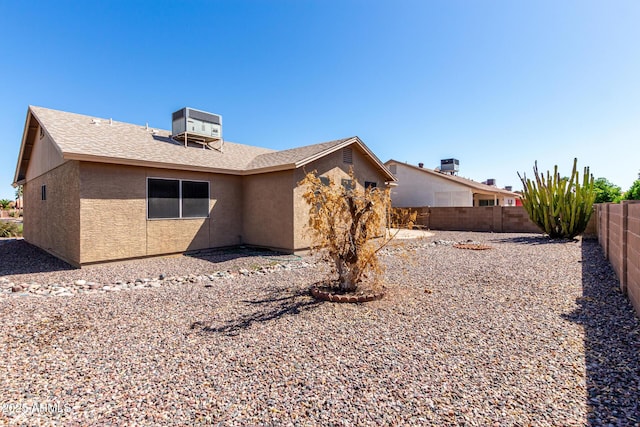 1501 E Colonial Dr, Chandler, AZ 85249 - back of property with a fenced backyard, central air condition unit, a shingled roof, and stucco siding