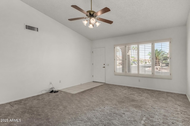 1501 E Colonial Dr, Chandler, AZ 85249 - spare room with vaulted ceiling, a ceiling fan, a textured ceiling, carpet floors, and visible vents