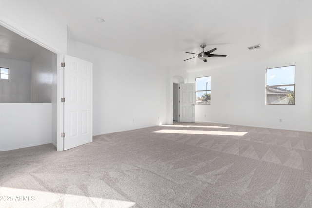 unfurnished room with ceiling fan and carpet floors