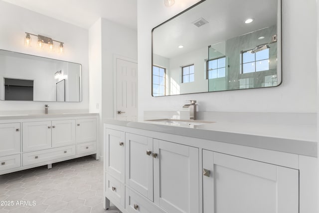 bathroom with tile patterned floors and vanity