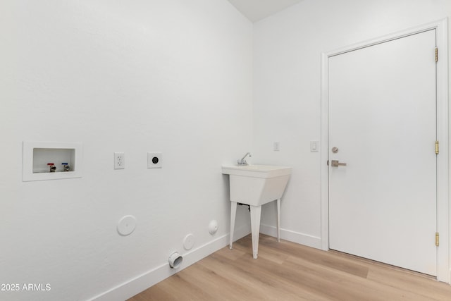 clothes washing area with hookup for an electric dryer, gas dryer hookup, light wood-type flooring, and hookup for a washing machine