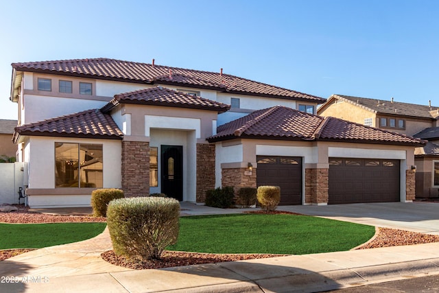 mediterranean / spanish house with a garage