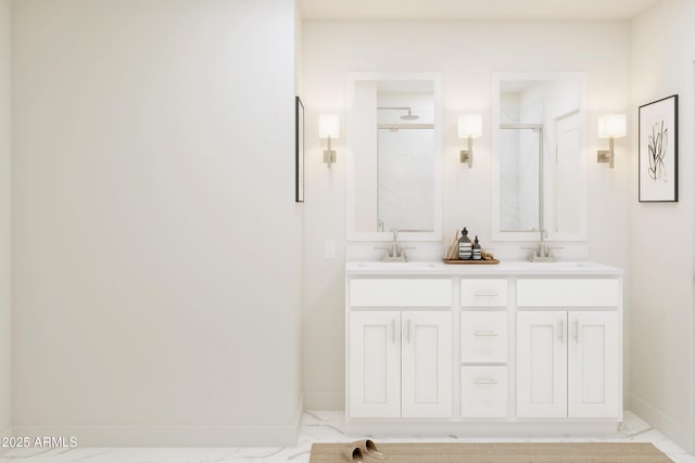 bathroom with a shower with door and vanity