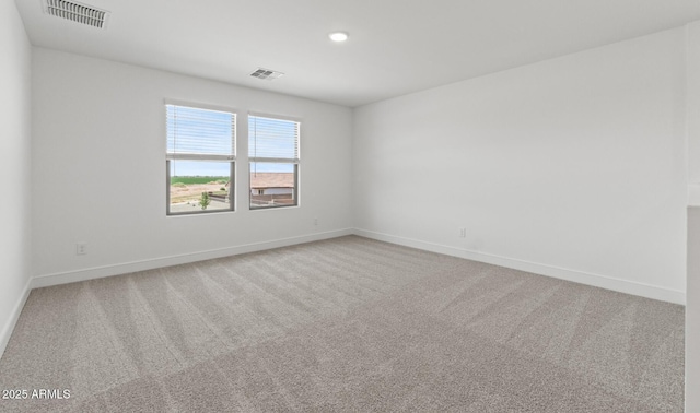 7416 S 76th Ln, Laveen, AZ 85339 - unfurnished room featuring carpet, baseboards, and recessed lighting