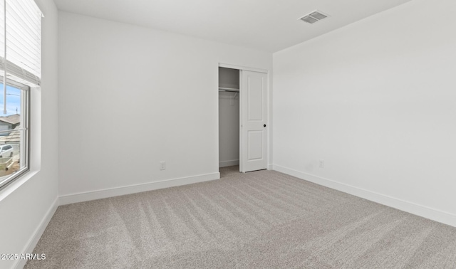 7416 S 76th Ln, Laveen, AZ 85339 - unfurnished bedroom with carpet flooring, baseboards, and a closet