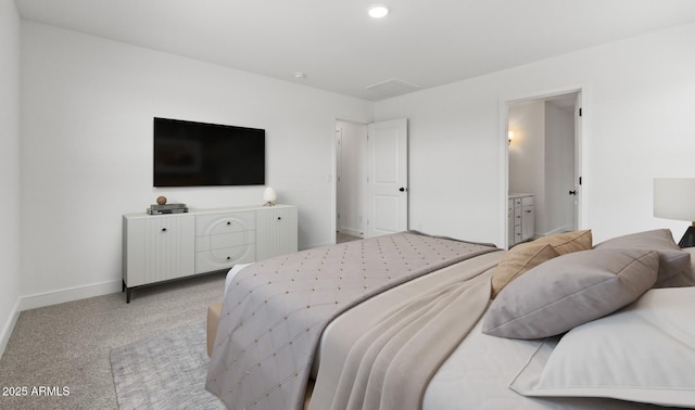 7416 S 76th Ln, Laveen, AZ 85339 - bedroom with baseboards, light carpet, and ensuite bathroom