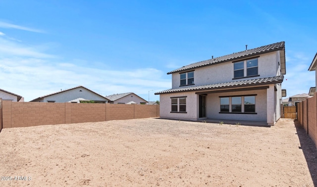 7416 S 76th Ln, Laveen, AZ 85339 - back of property featuring stucco siding, a fenced backyard, and a tile roof