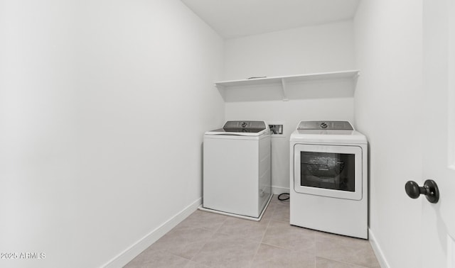 7416 S 76th Ln, Laveen, AZ 85339 - laundry area featuring washing machine and clothes dryer, baseboards, and light tile patterned flooring