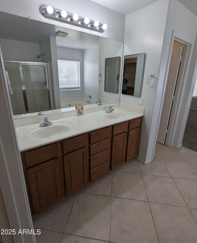 15446 W Jenan Dr, Surprise, AZ 85379 - full bathroom with a stall shower, tile patterned floors, double vanity, and a garden tub