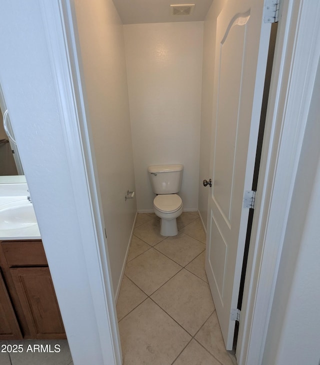 15446 W Jenan Dr, Surprise, AZ 85379 - bathroom featuring tile patterned flooring, toilet, vanity, and baseboards