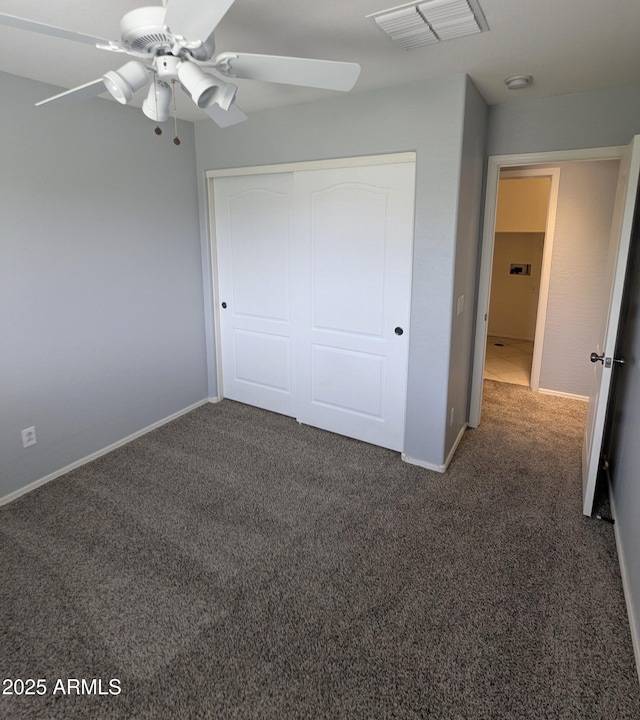 15446 W Jenan Dr, Surprise, AZ 85379 - unfurnished bedroom with carpet floors, a closet, baseboards, and a ceiling fan