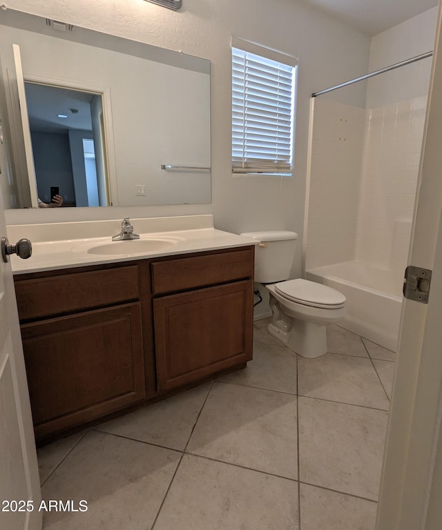15446 W Jenan Dr, Surprise, AZ 85379 - bathroom featuring toilet, tile patterned floors, vanity, and shower / tub combination