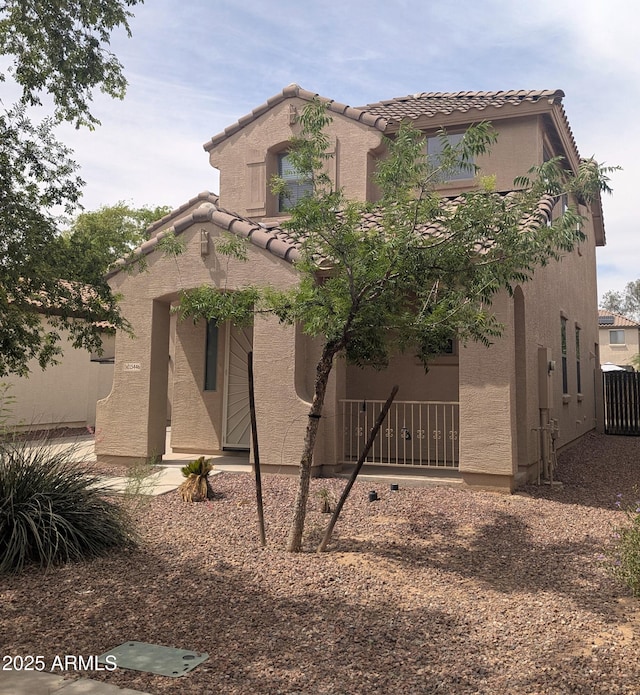 15446 W Jenan Dr, Surprise, AZ 85379 - view of front of house with a tiled roof and stucco siding