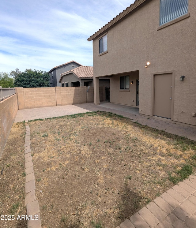 15446 W Jenan Dr, Surprise, AZ 85379 - fenced backyard with a patio area