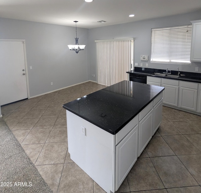 15446 W Jenan Dr, Surprise, AZ 85379 - kitchen featuring a sink, light tile patterned floors, dark countertops, dishwasher, and recessed lighting