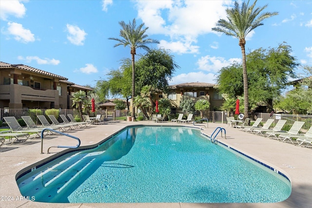 view of swimming pool with a patio area