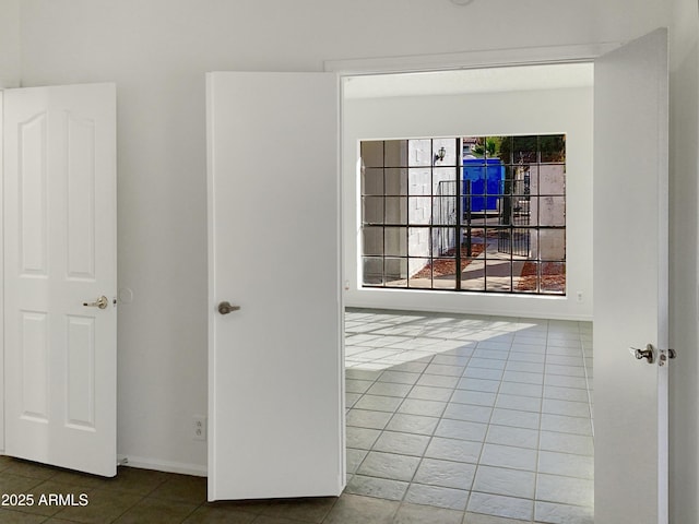 spare room with tile patterned floors