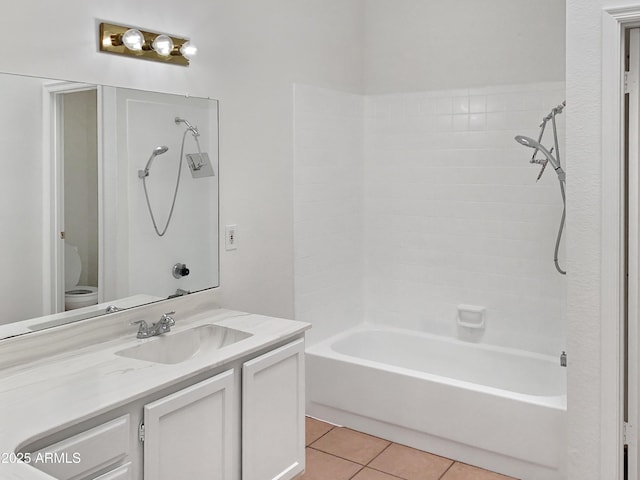 full bathroom featuring vanity, toilet, washtub / shower combination, and tile patterned flooring