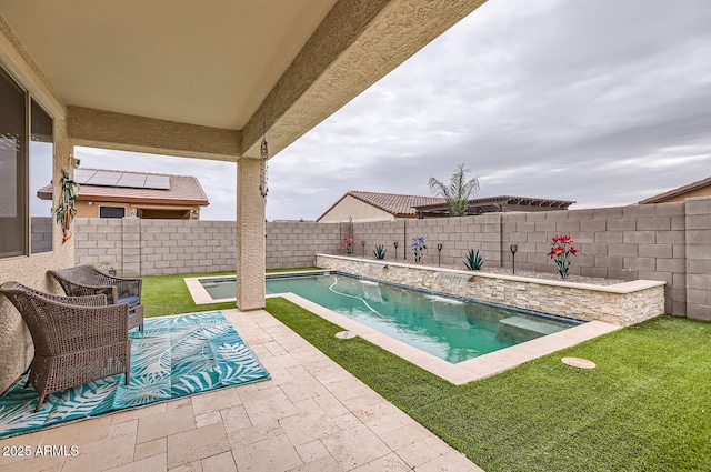 view of pool with a fenced in pool, a yard, a fenced backyard, and a patio