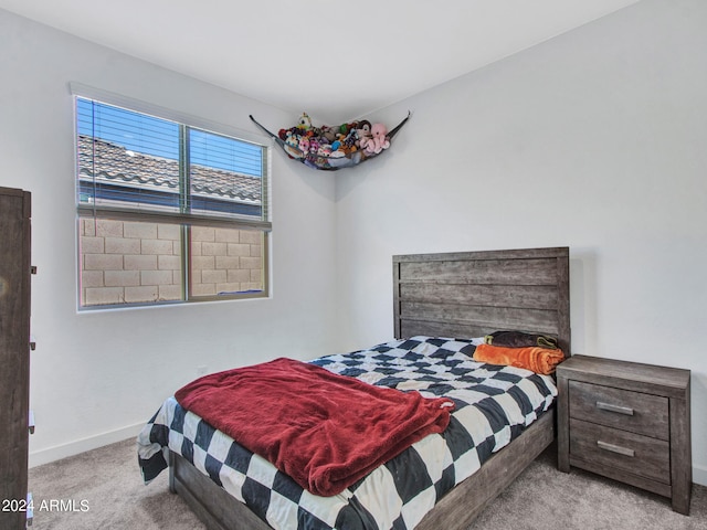 bedroom with light carpet