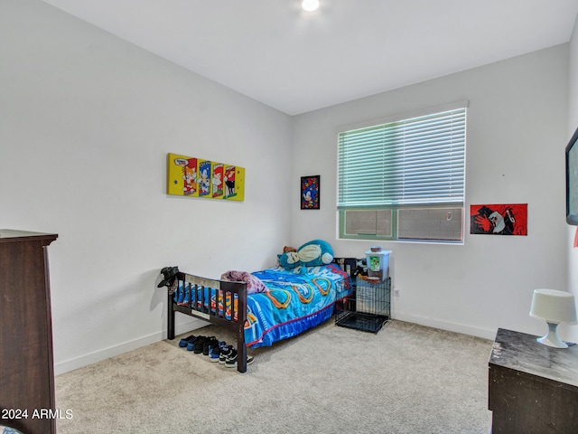 bedroom with light colored carpet