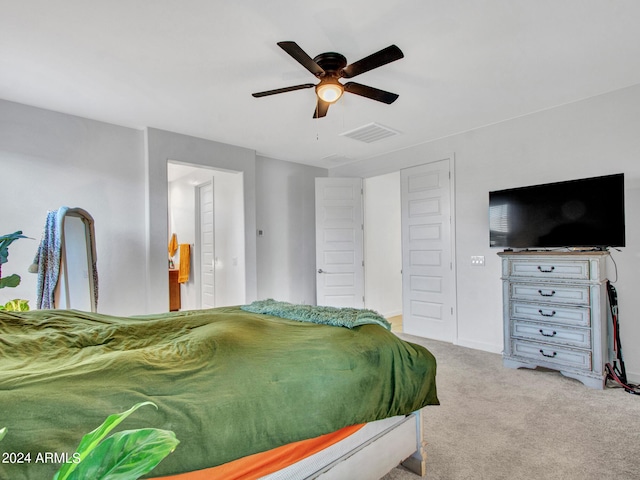 carpeted bedroom featuring ceiling fan and visible vents